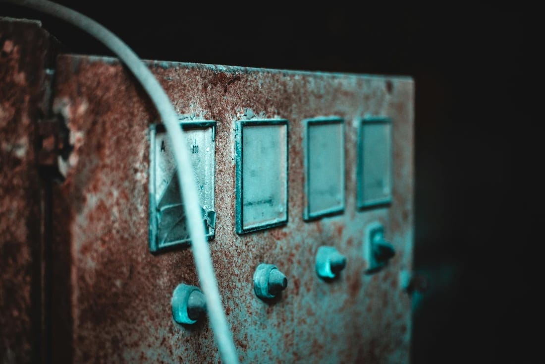 Old rusty electric panel with dials and cable - the legacy DB we replace with a modular RCCB board during a Garkheda home upgrade