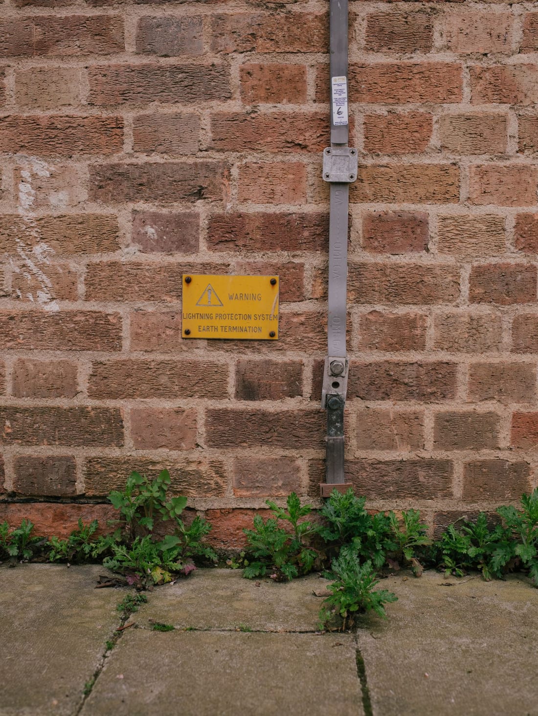 Electrical conduit wiring being installed in a wall during construction - the physical routing of earth conductors from electrodes to the panel earth bus