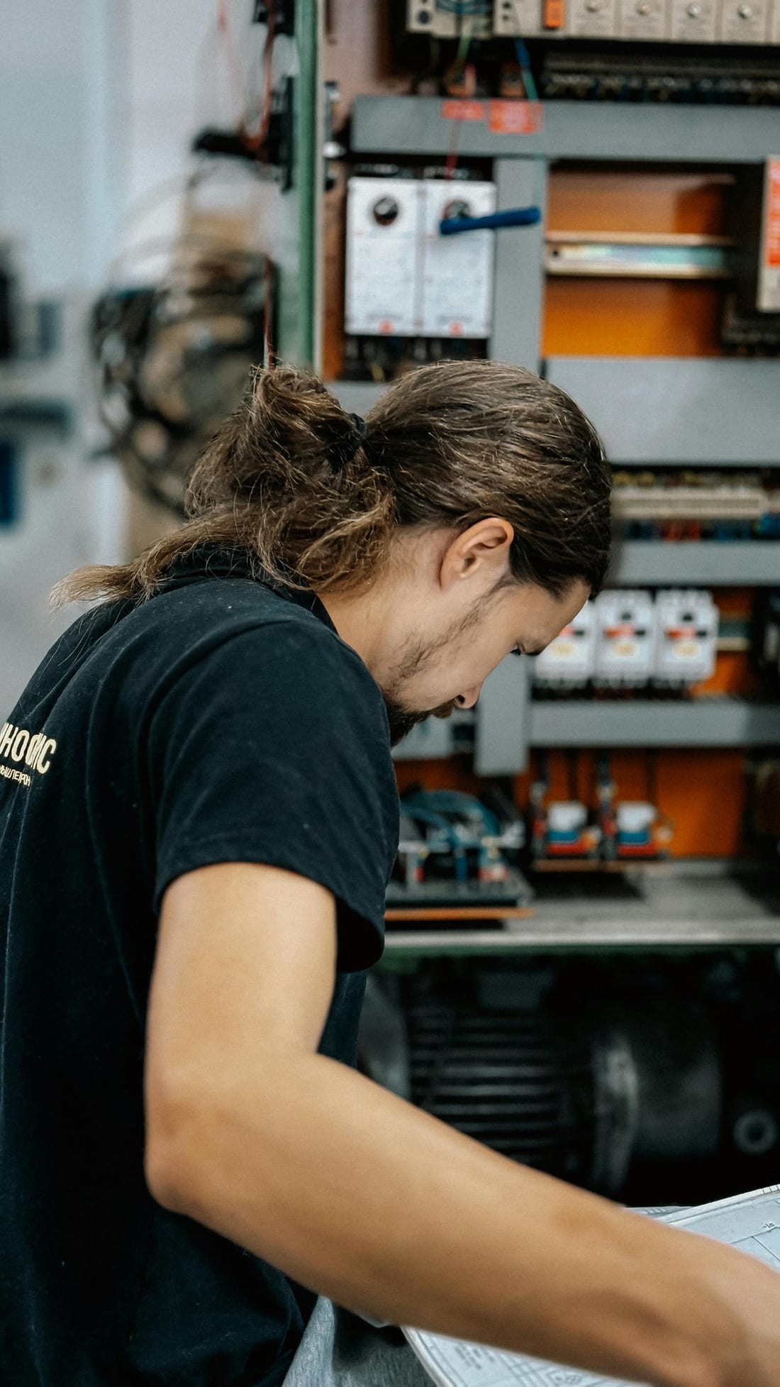 Indian electrical engineer reviewing an industrial distribution panel during a planned AMC visit instead of an emergency breakdown call - Shaats Electrical, Chh. Sambhajinagar (Aurangabad)