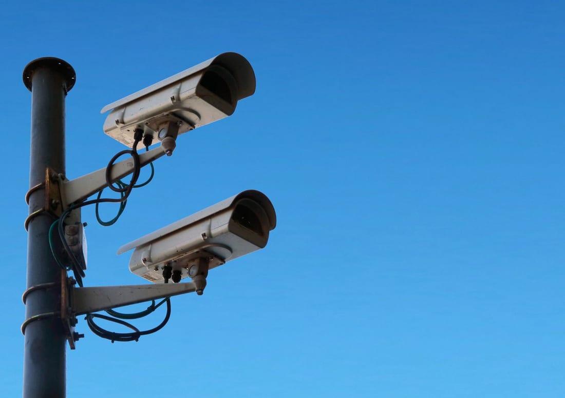 Weathered outdoor CCTV cameras exposed to dust and rain - the kind of gradual degradation that a scheduled CCTV AMC visit catches before footage is lost