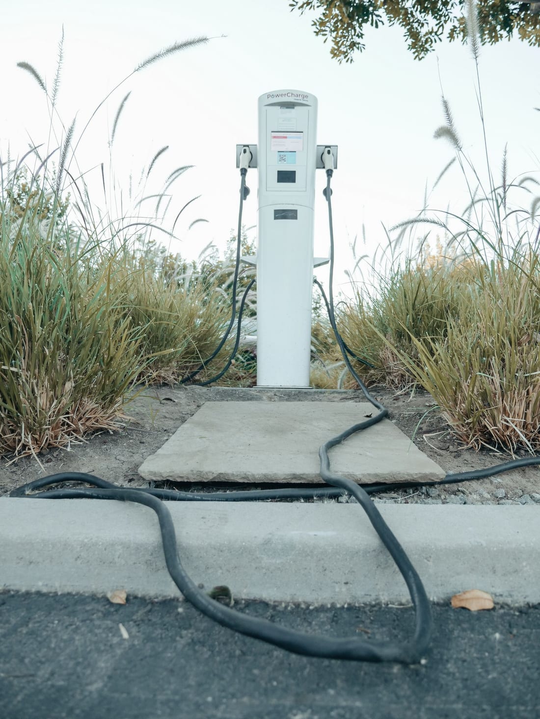 EV charging pedestal with charging cables - dedicated circuit, RCCB and earthing behind a safe home EV charging point