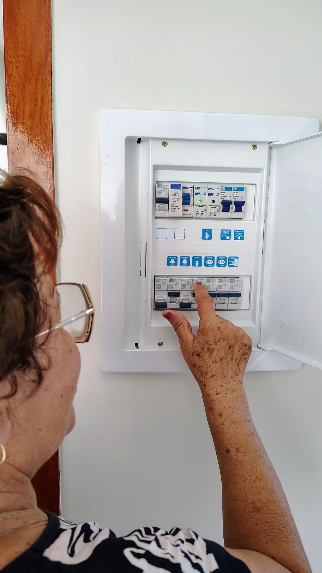 Indian homeowner looking at a tripped MCB inside a residential distribution board - MCB / RCCB tripping troubleshooting by Shaats Electrical, Chh. Sambhajinagar (Aurangabad)