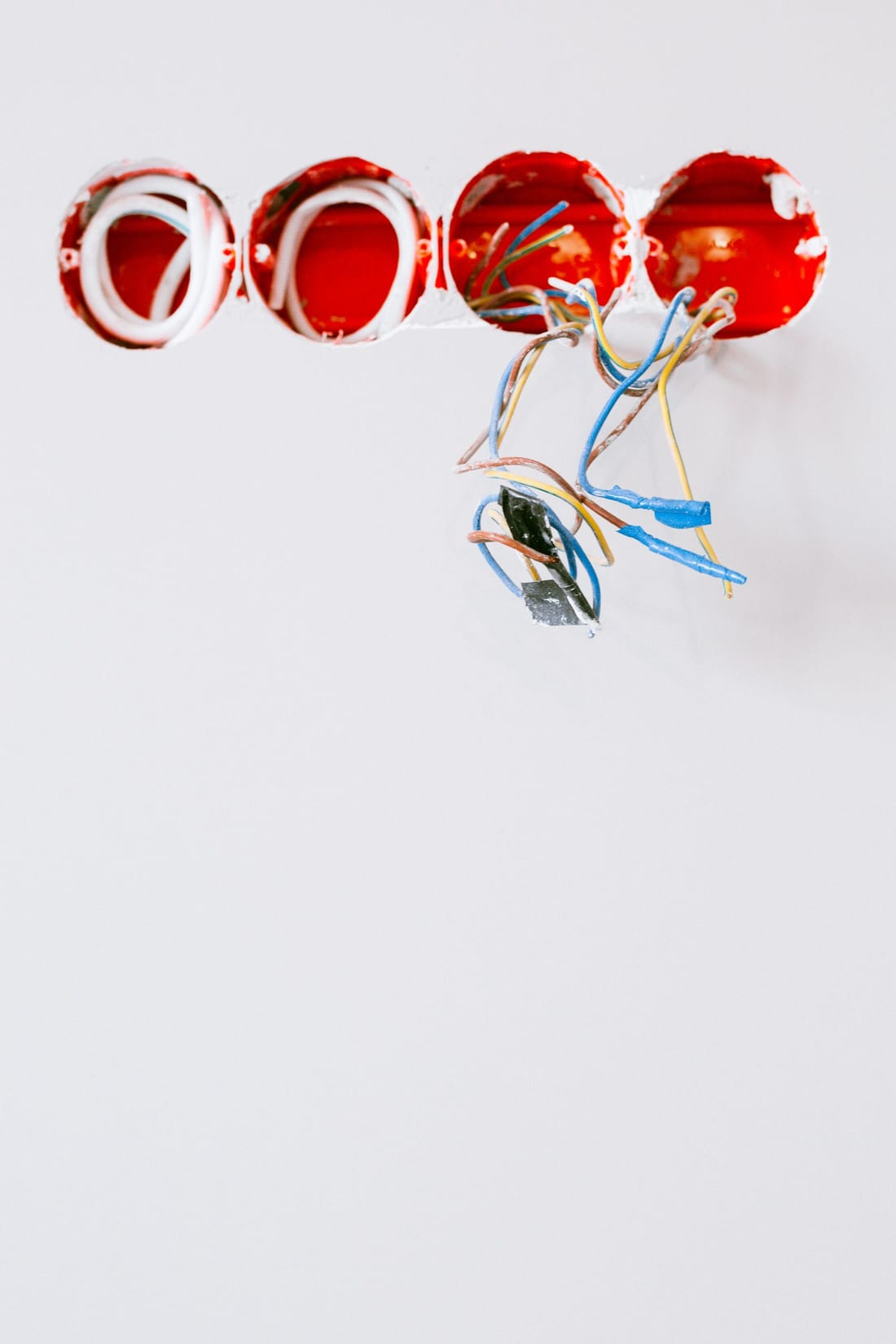 Socket points and wiring on a wall during a new-home electrical installation, before fixtures are fitted