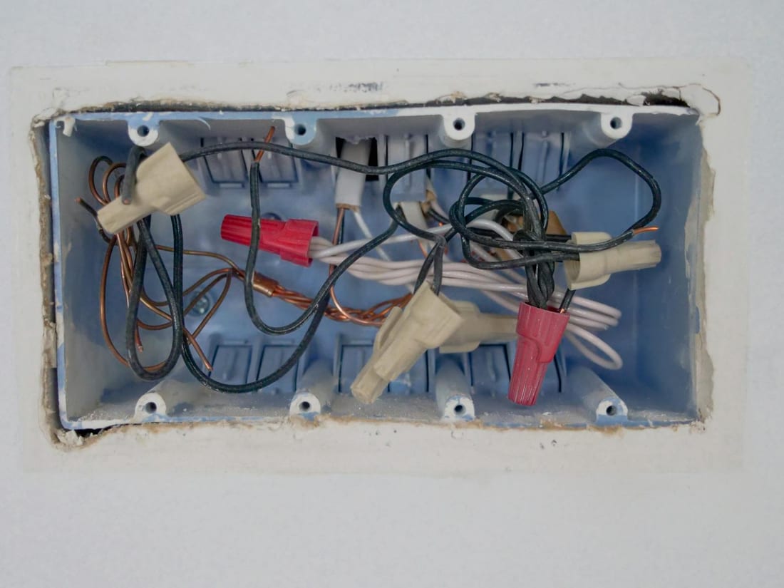 Open commercial switchboard showing the incoming connection and wiring for a new shop or office