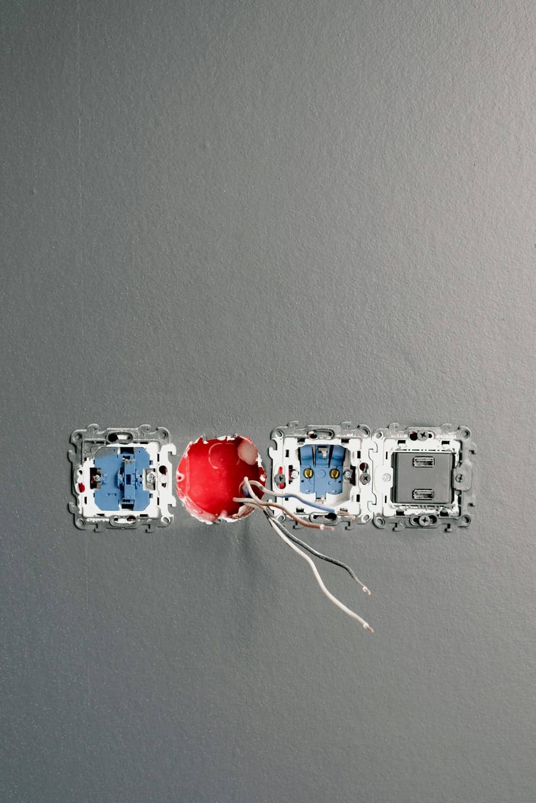 Concealed wiring work in progress in a Chh. Sambhajinagar (Aurangabad) residential renovation - sockets and switches still partially installed