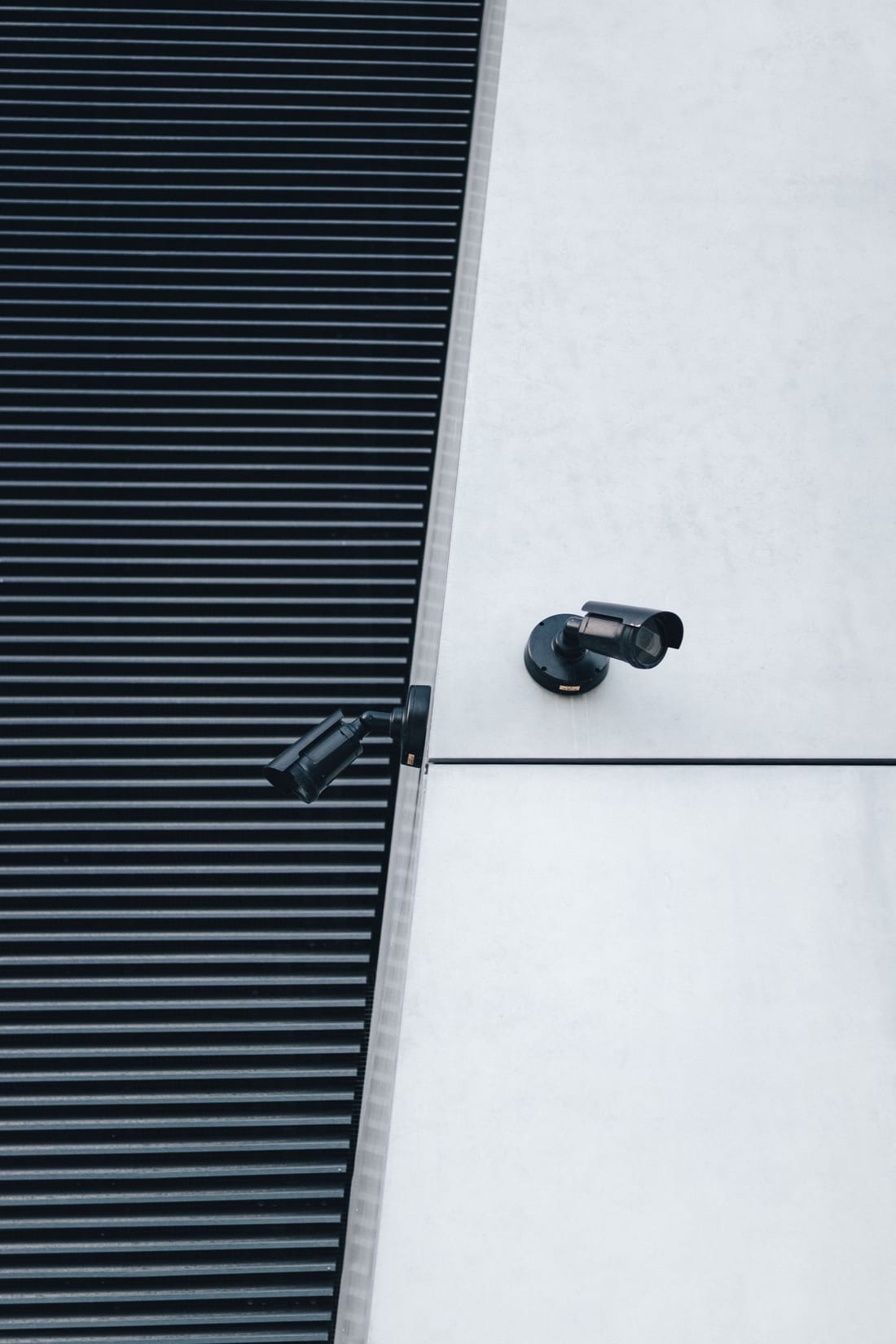 Technician mounting a CCTV security camera on an exterior wall during installation - full end-to-end CCTV camera installation service for homes and factories in Chh. Sambhajinagar (Aurangabad)