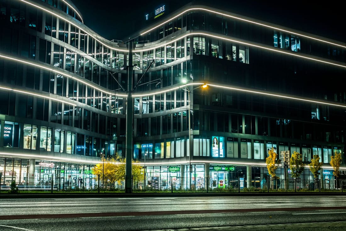 Modern commercial office building illuminated at night - the kind of commercial building where Shaats Electrical handles electrical installation and ongoing maintenance