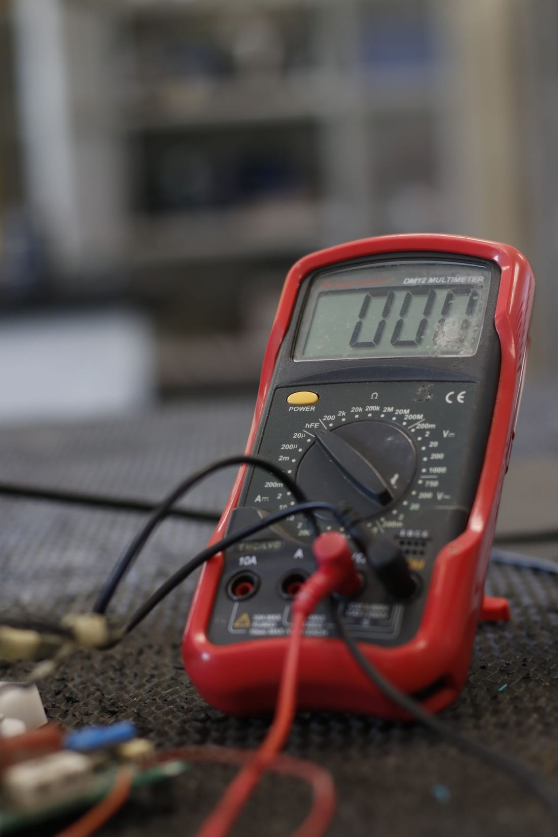 Professional multimeter with test probes for electrical measurement - the kind of calibrated instrument used for earth resistance measurement per IS 3043