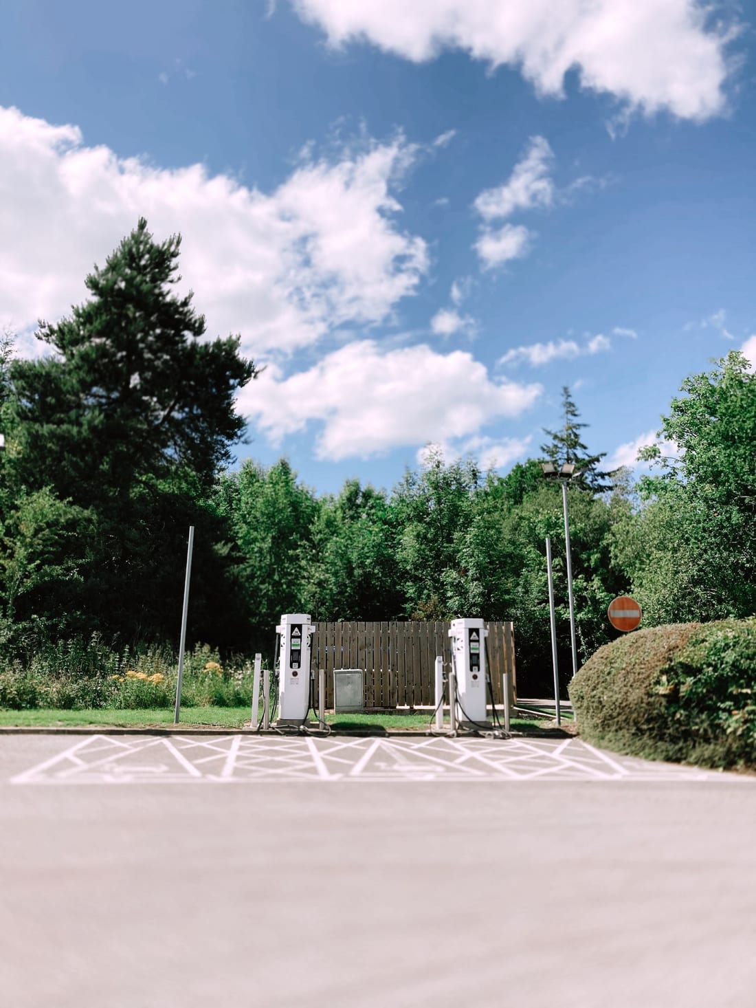 Two EV charging pedestals installed in a marked parking bay - multi-point EV charging electrical setup for housing societies, hotels and dealerships in Chh. Sambhajinagar