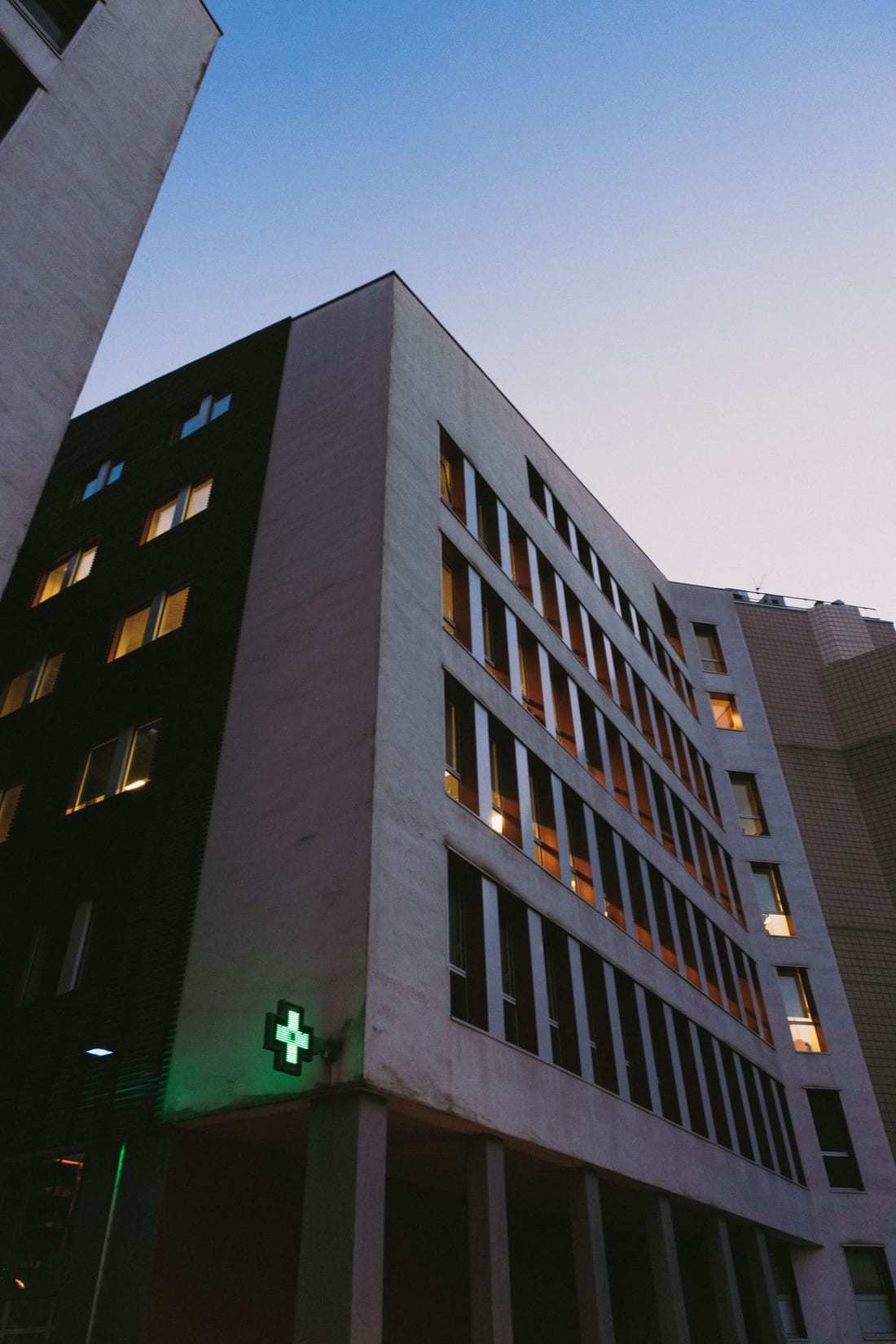 Modern institutional building exterior at dusk - the kind of government schools, hospitals and municipal buildings for which Shaats Electrical provides IS-compliant electrical work in Chh. Sambhajinagar