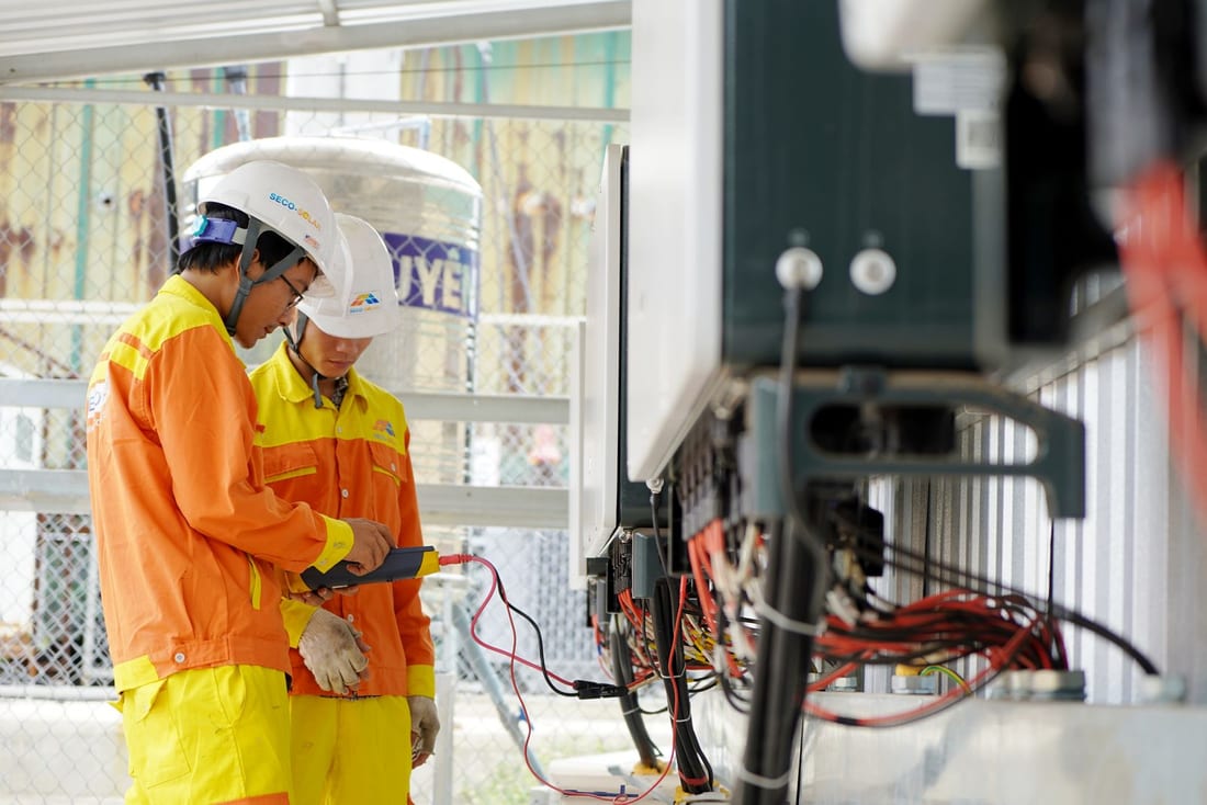 Electrical engineer using a test instrument during a planned maintenance visit - preventive maintenance with calibrated instruments and written reports for Chikalthana factories and hotels